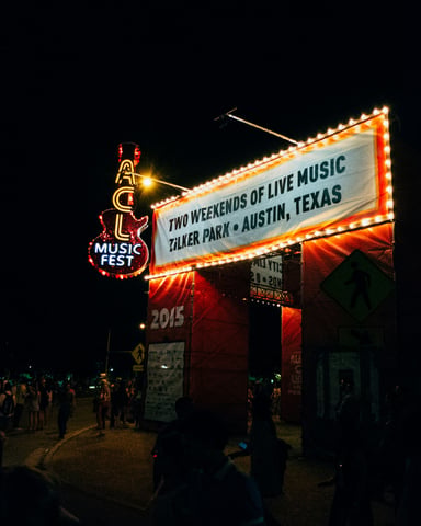 ACL Music Fest marquee sign lit up at night in Austin, Texas