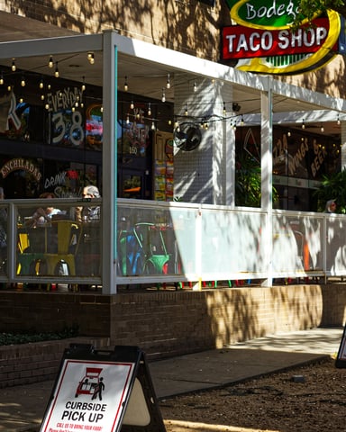 Bodega Taco Shop exterior with neon sign in downtown Austin