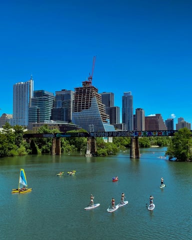 Austin skyline with paddleboarders on Lady Bird Lake