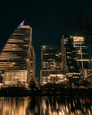 Austin skyline lit up at night reflected in Lady Bird Lake
