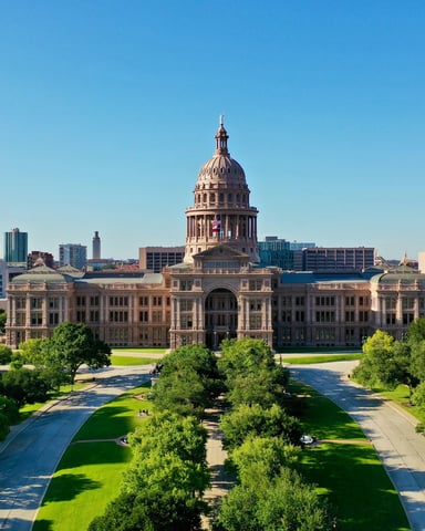 Aerial view of Texas State Capitol with lush green grounds