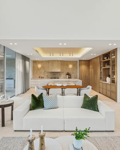 Grand open-plan living room with floor-to-ceiling glass